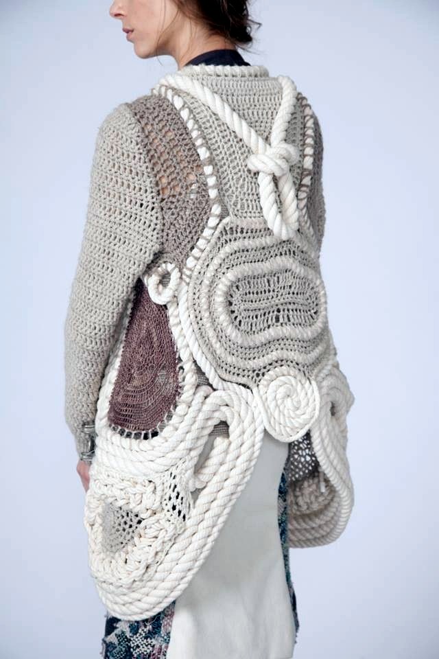 Back view of pale crochet and rope-integrated knit construction
