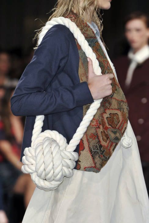 Close crop of rope-structured accessory integrated into runway look